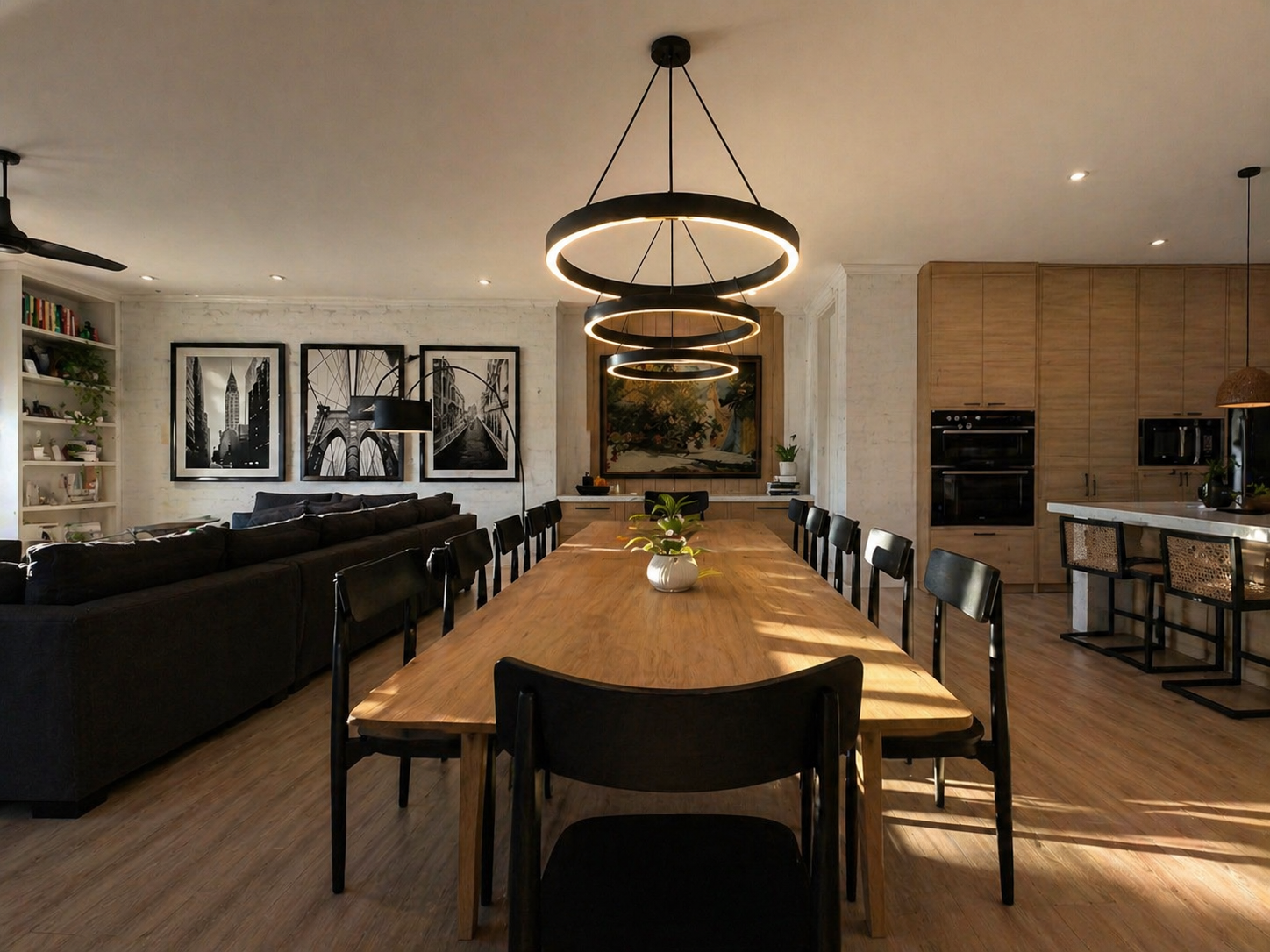 A luxury kitchen and living space with warm finishes and refined seating